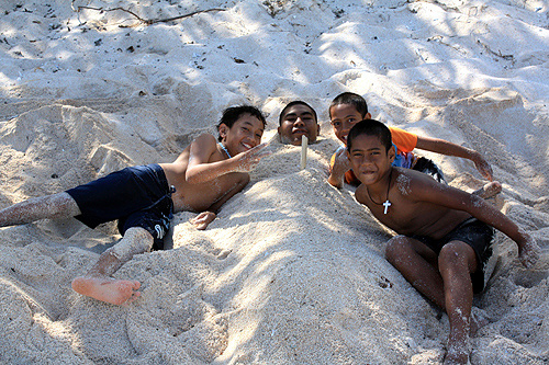 Boys Playing on a beach photo